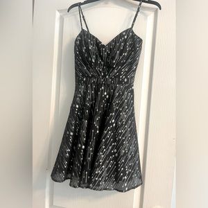 Size one black mini dress with silver detailing.